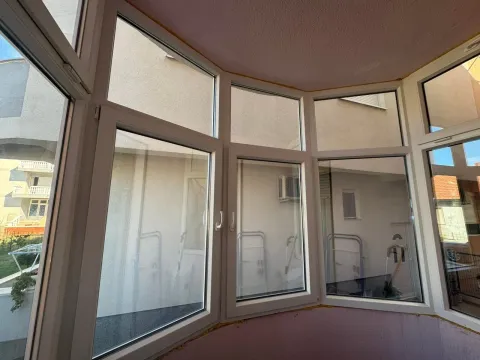 Glazed balcony with white PVC window frames. - image 9