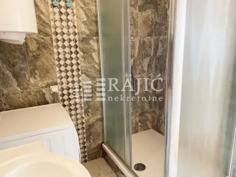 View of the bathroom with a shower cabin. - image 16