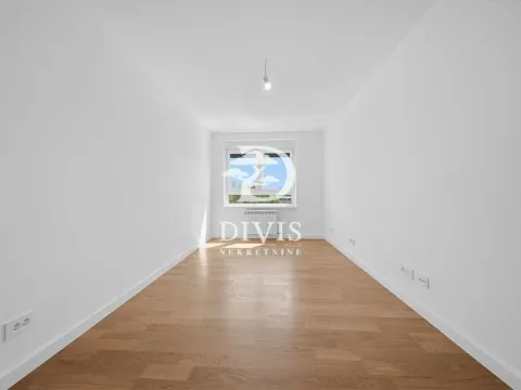 Empty room with white walls, parquet flooring, and a window at the end. - image 4