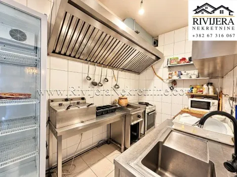 Commercial kitchen with professional stainless steel equipment and appliances. - image 7