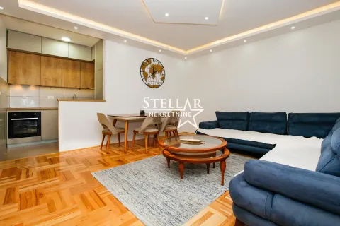 Spacious living room with dining area and connected kitchen. - image 3
