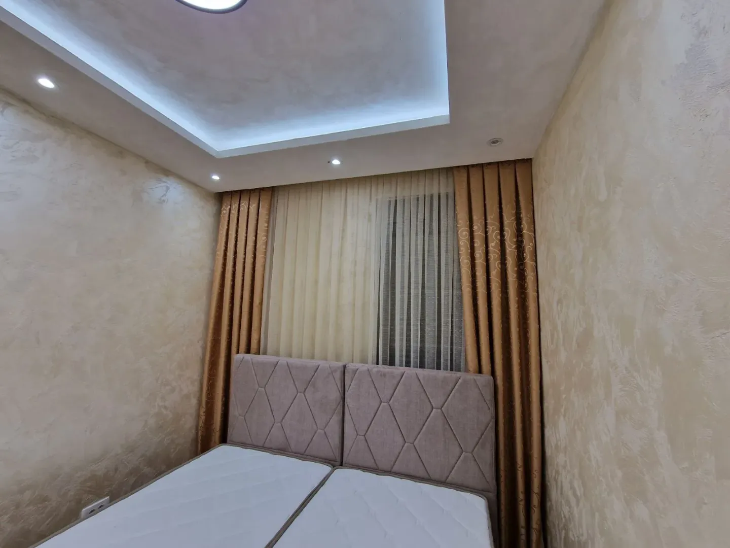 Bright bedroom with decorative walls.