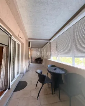 Glazed balcony with patio furniture. - image 10