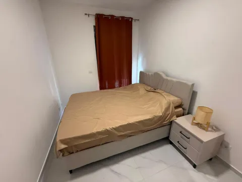 Bedroom with a double bed and a nightstand. - image 5