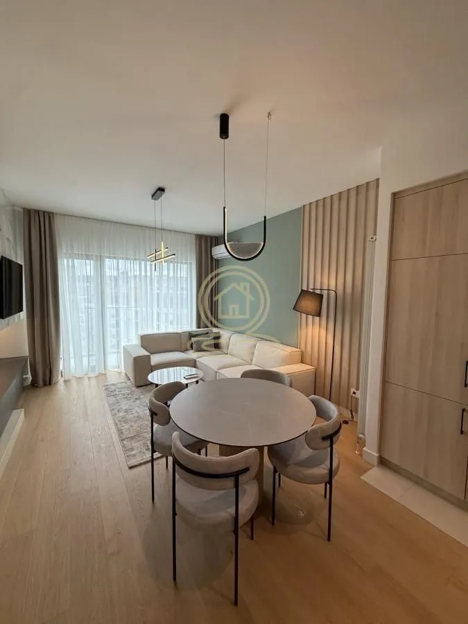 Living room with dining area and modern furniture.
