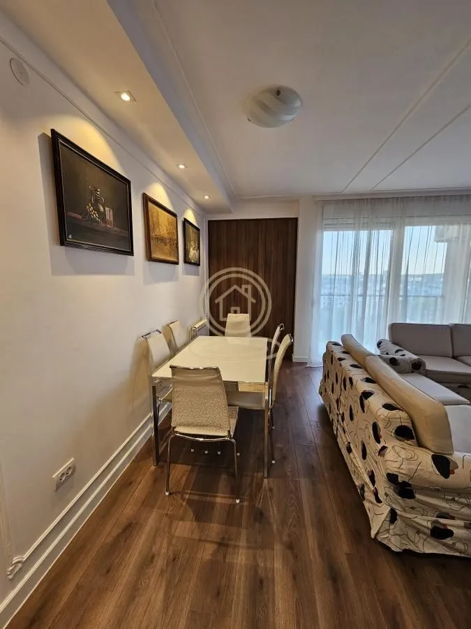 Living room with a dining area and seating furniture.