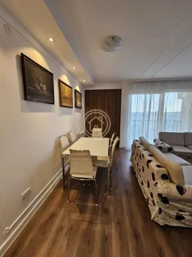 Living room with a dining area and seating furniture. - image 15