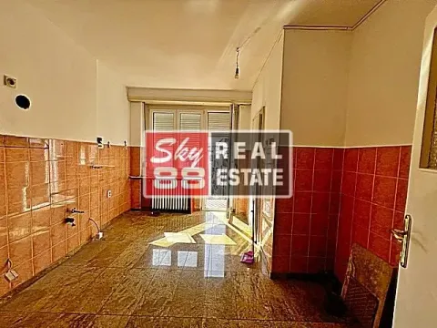 Empty kitchen with ceramic tiles on the walls and floor. - image 13