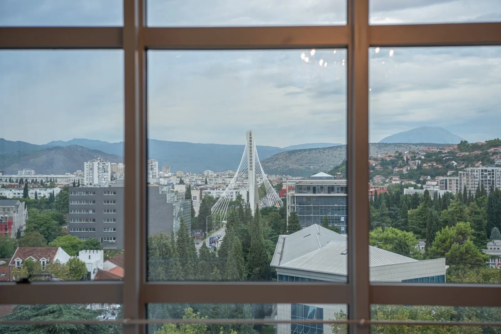 View through the window of the city and the bridge.
