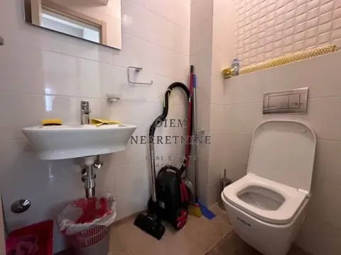 Small bathroom with a sink and toilet bowl. - image 10