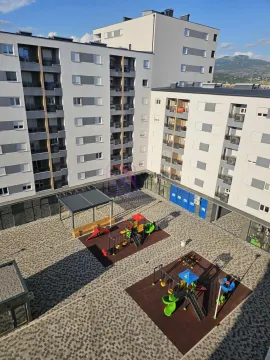 View from the building overlooking the courtyard with a children's playground. - image 15