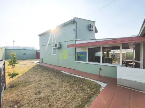 Exterior view of the house with a yard and terrace. - image 5