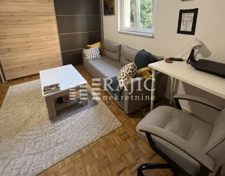 Living room with sofa, desk and wardrobe. - image 2
