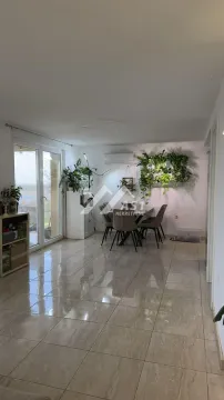 Spacious living room with dining area and terrace access. - image 3