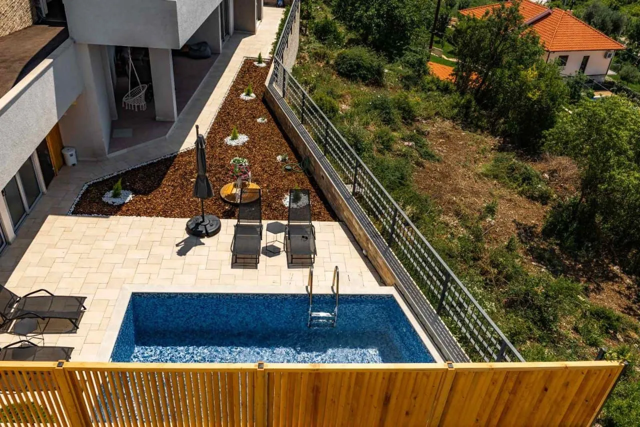 Aerial view of the courtyard with a swimming pool and sunbathing area.
