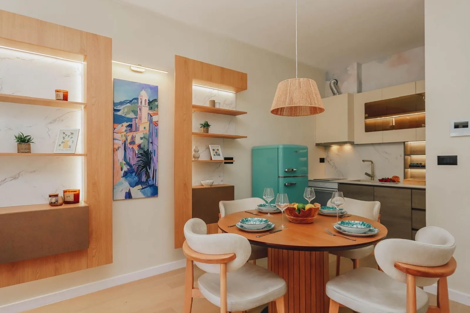 Modern kitchen with dining area and built-in appliances.