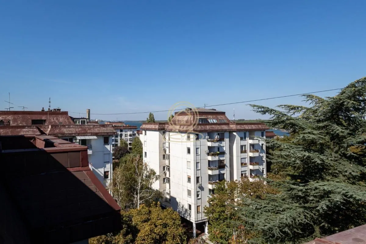 View from the terrace overlooking neighboring residential buildings and the surroundings.