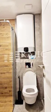 Modernly equipped bathroom with a walk-in shower and concealed cistern. - image 10