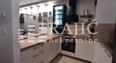 Modern kitchen with wooden elements and built-in appliances. - image 2
