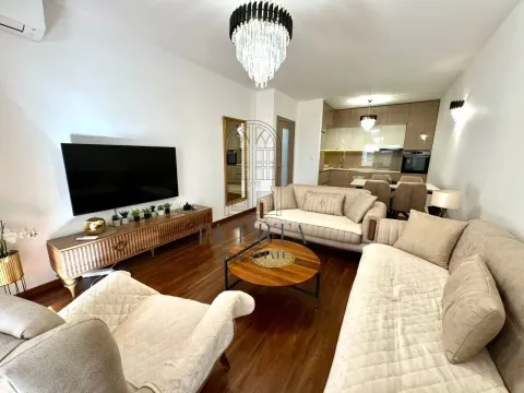 Spacious living room connected to the dining area and kitchen. - image 3
