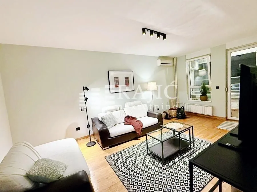 Living room with a sofa and coffee table.