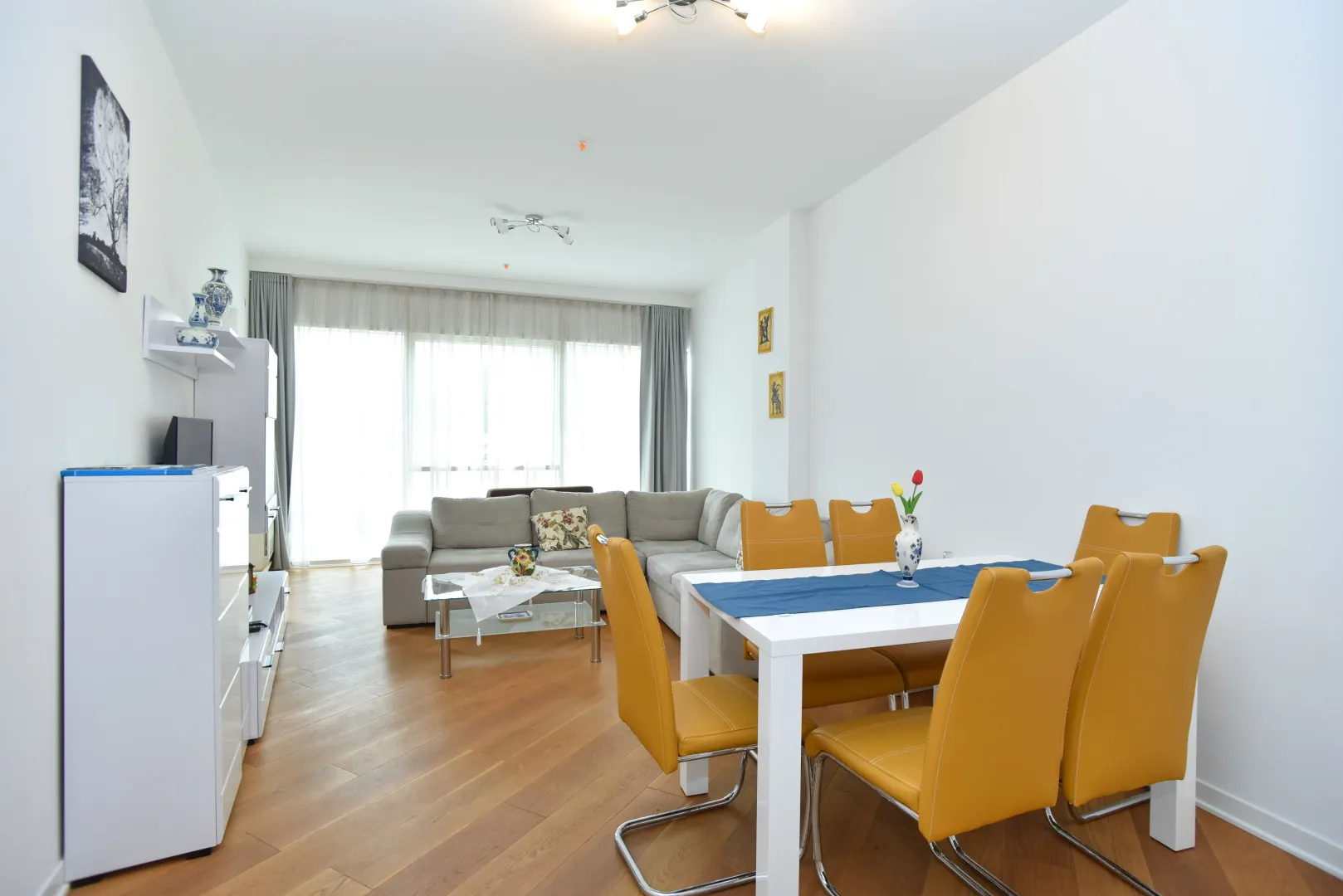 Spacious living room with a dining area and seating furniture.