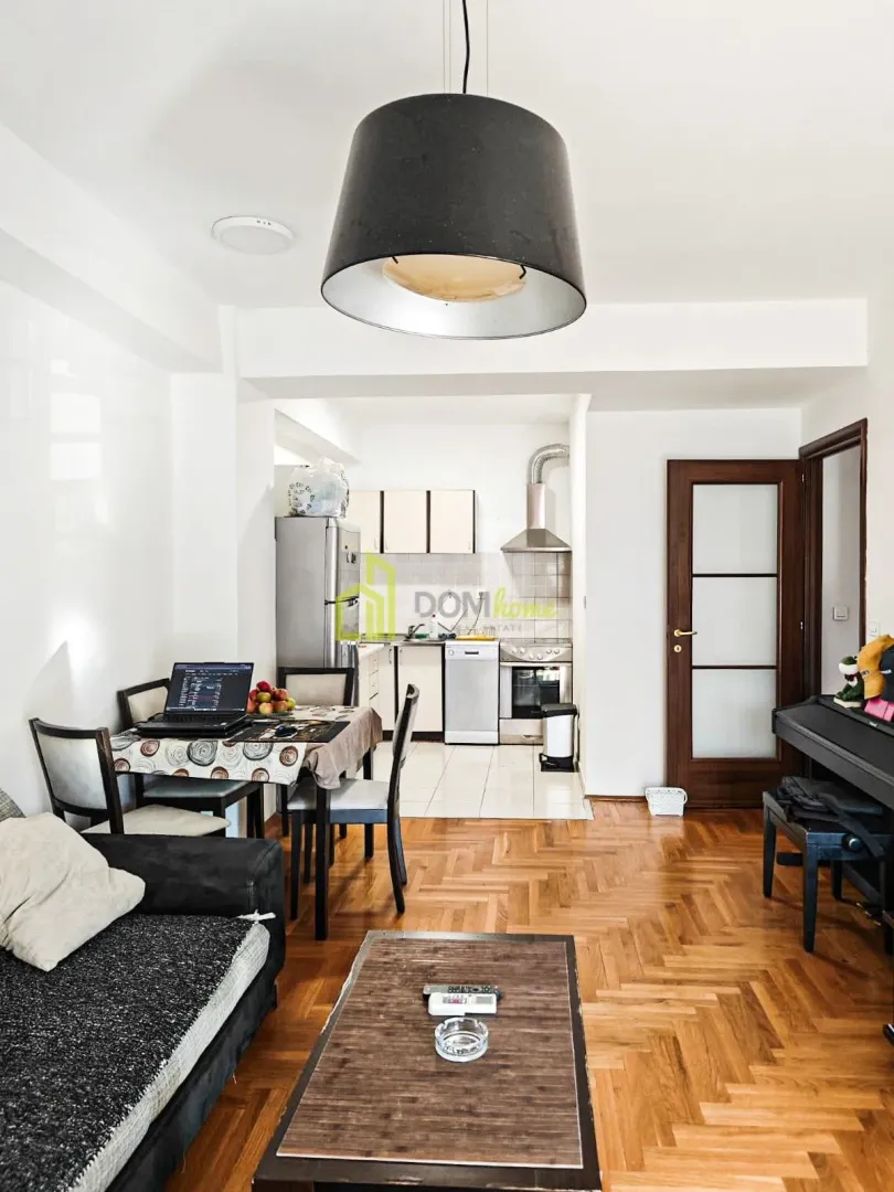 Living room connected with dining area and kitchen.