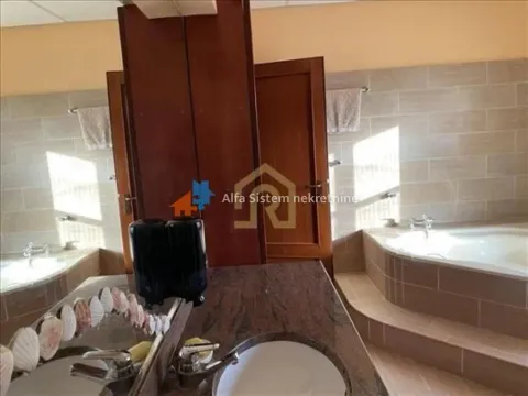 Bathroom with bathtub and washbasin. - image 21