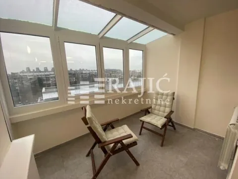 Glazed terrace with wooden chairs and roof windows. - image 11