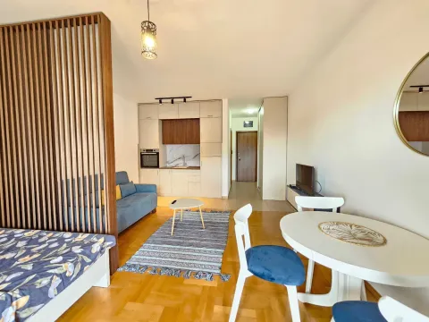 Living room with an open-plan kitchen and dining area. - image 6