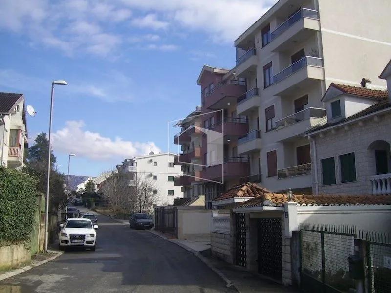 View of the apartment building and street in the neighborhood.