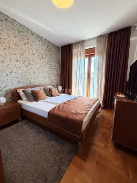 Furnished bedroom with a double bed, wardrobe, and access to the terrace. - image 8