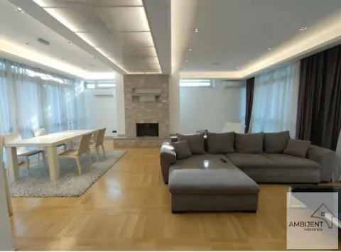 Spacious living room with a sofa set, dining area, and fireplace. - image 3