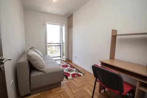 Small room with a pull-out sofa, a desk, and access to the terrace. - image 6