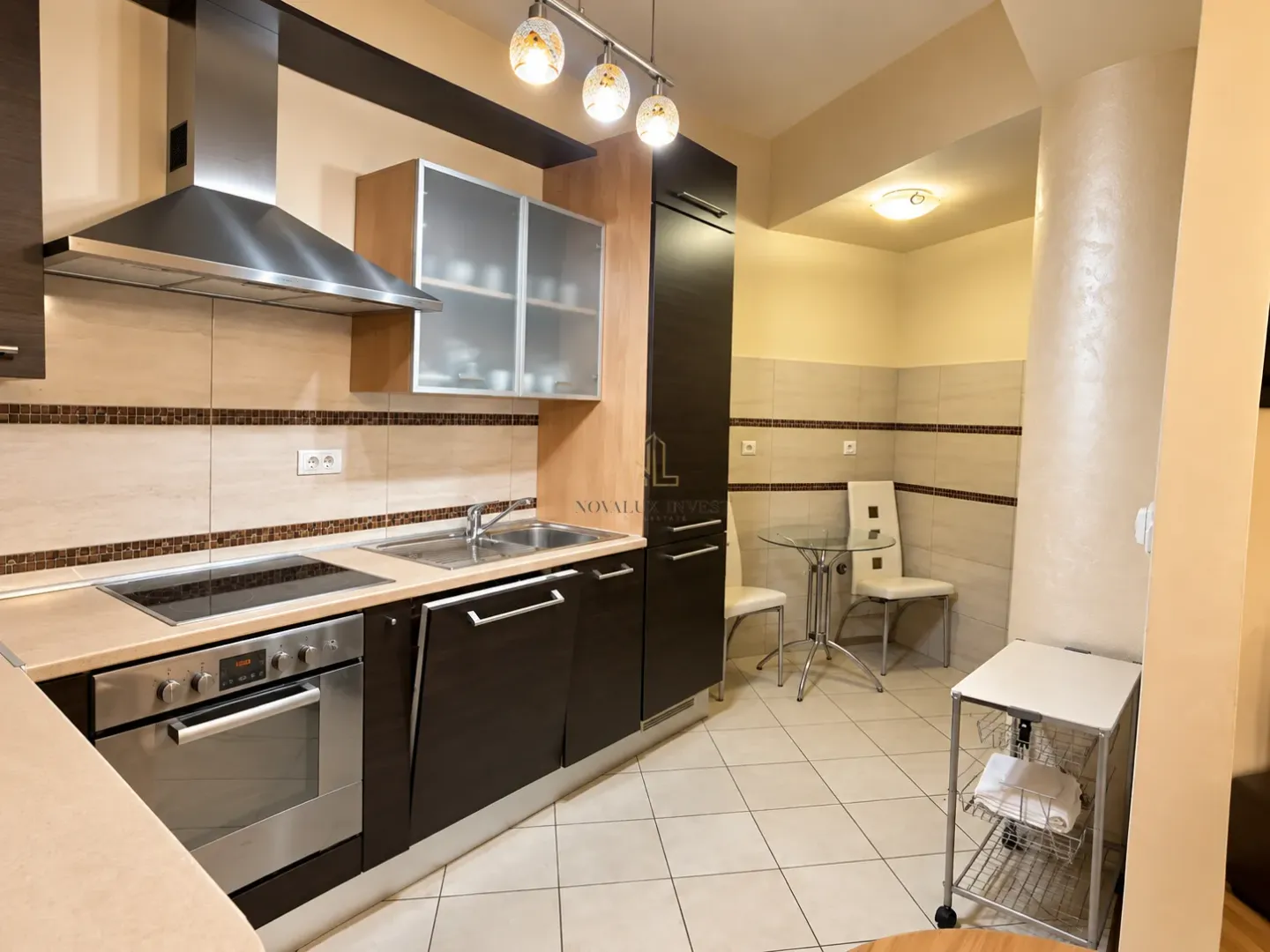 Kitchen with built-in appliances and a dining nook.