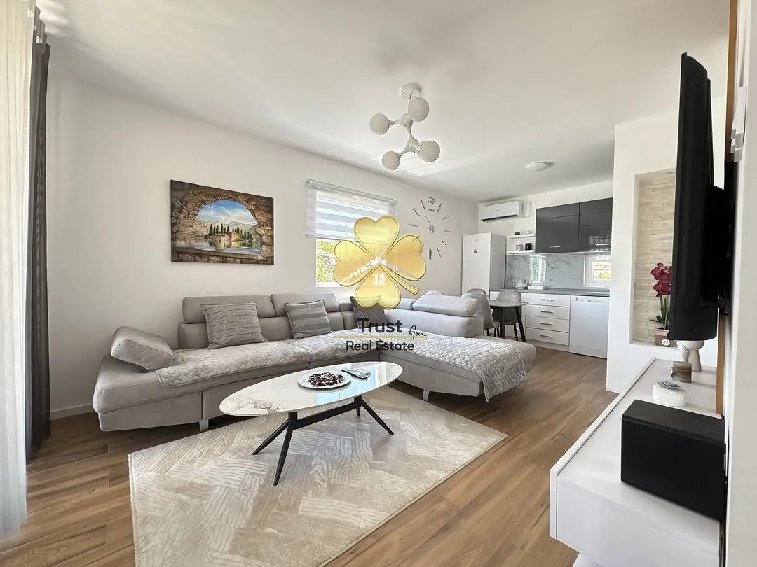 Spacious living room connected to the dining area and kitchen.