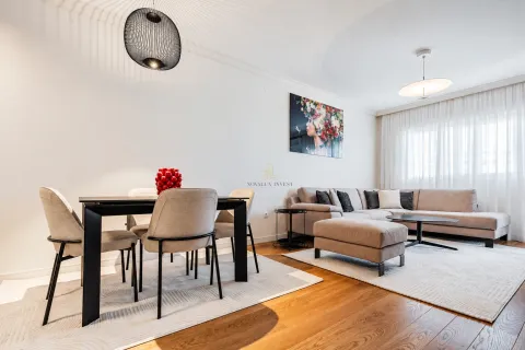 Living room with a dining area and modern furniture. - image 3