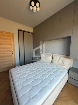 Bedroom with a double bed and fitted wardrobes. - image 7