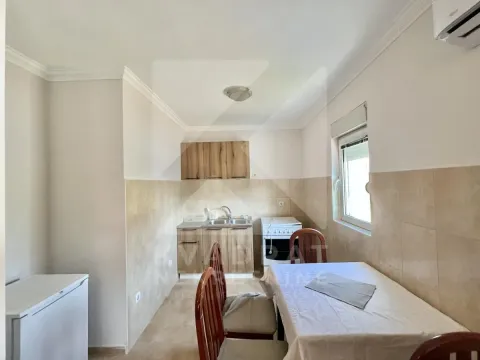 Kitchen with a dining table and chairs. - image 2