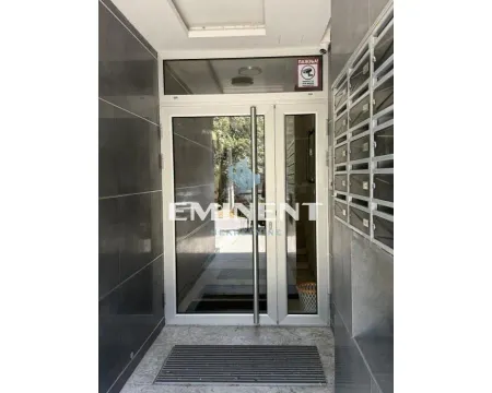 Building entrance with glass doors and mailboxes. - image 18
