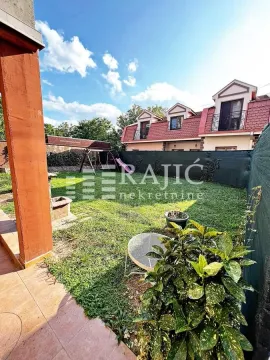 Family house yard with a lawn and children's playground. - image 2