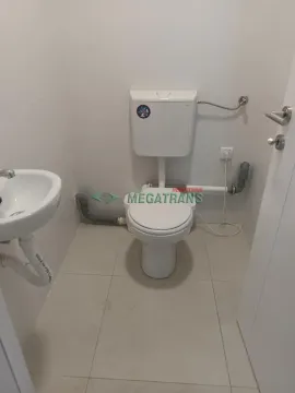 Smaller bathroom with a toilet and a sink. - image 5
