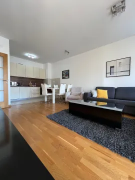 Spacious living room connected to the dining area and kitchen. - image 5