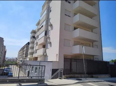 View of the exterior of a residential building with balconies and entrance. - image 3