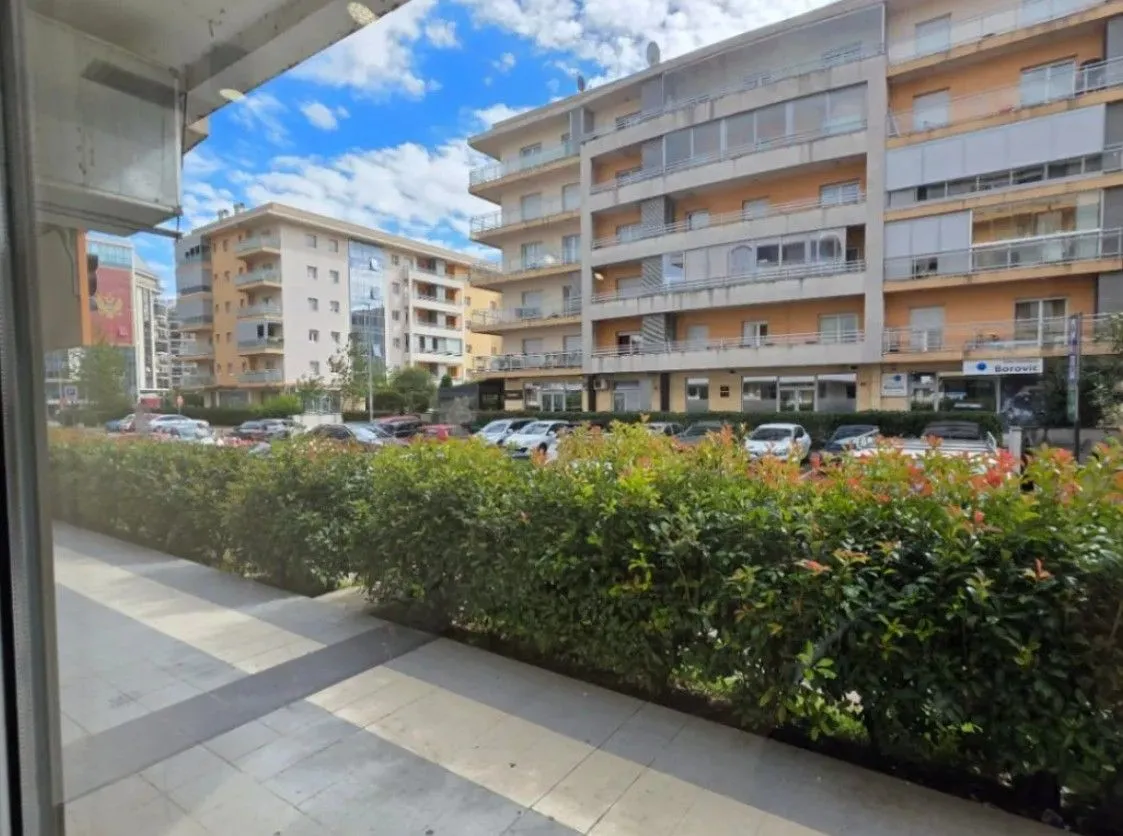 View from the property overlooking residential buildings and a parking lot.