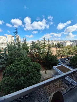 View from the terrace overlooking the neighborhood and greenery. - image 12