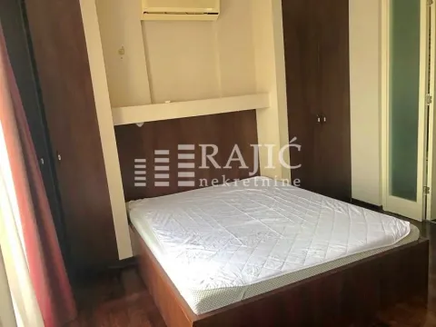 Furnished bedroom with a double bed and built-in wardrobes. - image 2