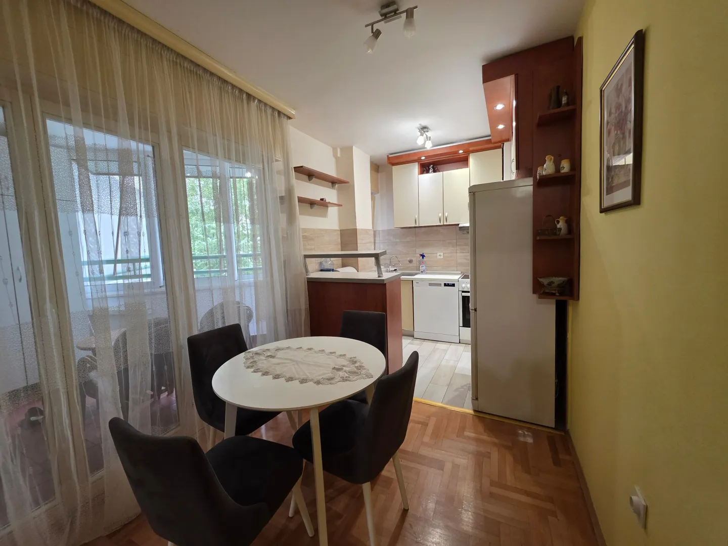 Kitchen with dining area and access to the balcony.