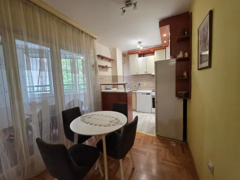 Kitchen with dining area and access to the balcony. - image 7