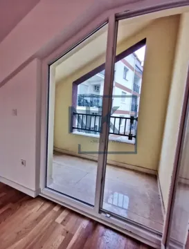 View of the covered terrace with sliding glass doors from the room. - image 5